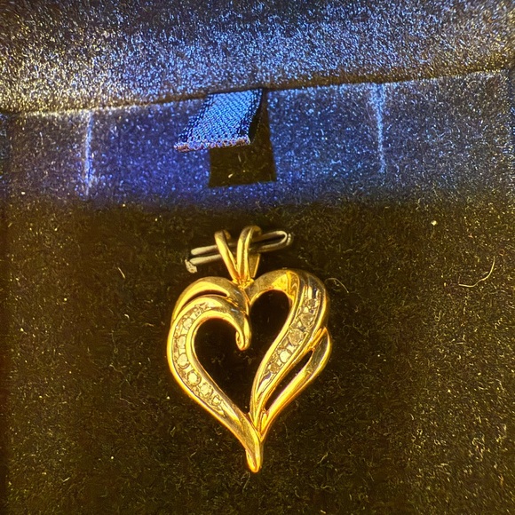 A 10k Heart Pendant set with Natural Diamonds